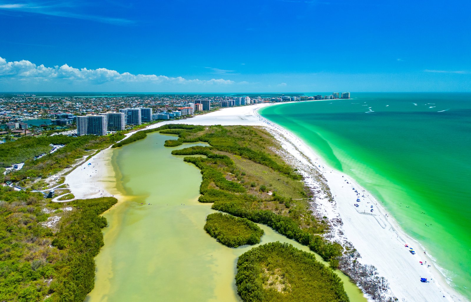 Aerial view of Tigertail Beach Park on Marco Island showing the clear lagoon and outer sandbar.